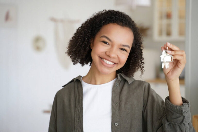 First Home Buyer holding keys to new home